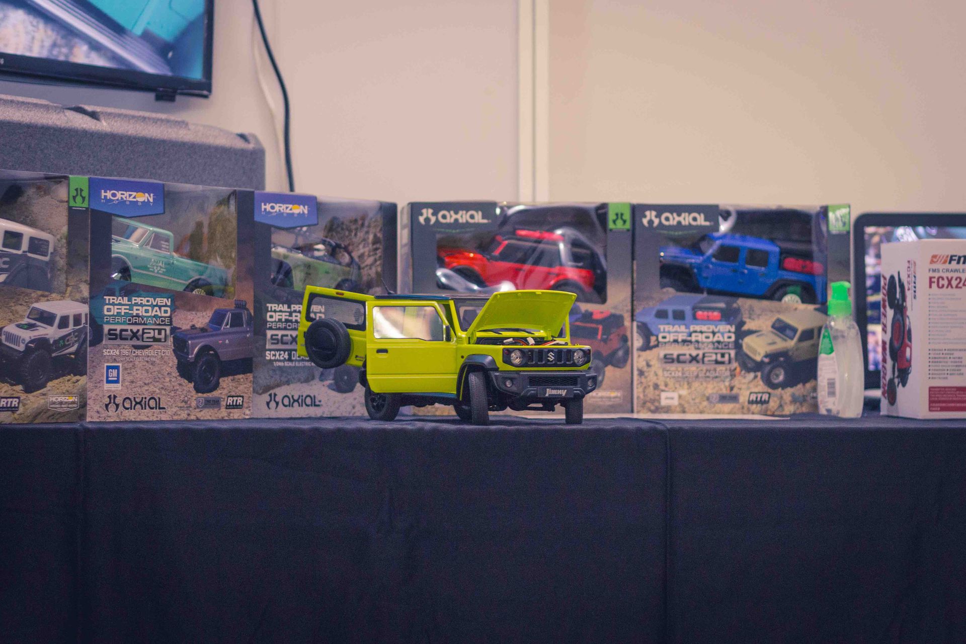 FMS 1/12 SUZUKI Jimny RTR Scale Model RC & Axial SCX24 RCs in background | Exhibit by FIGURA Kenya